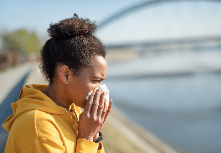 Woman Sneezing