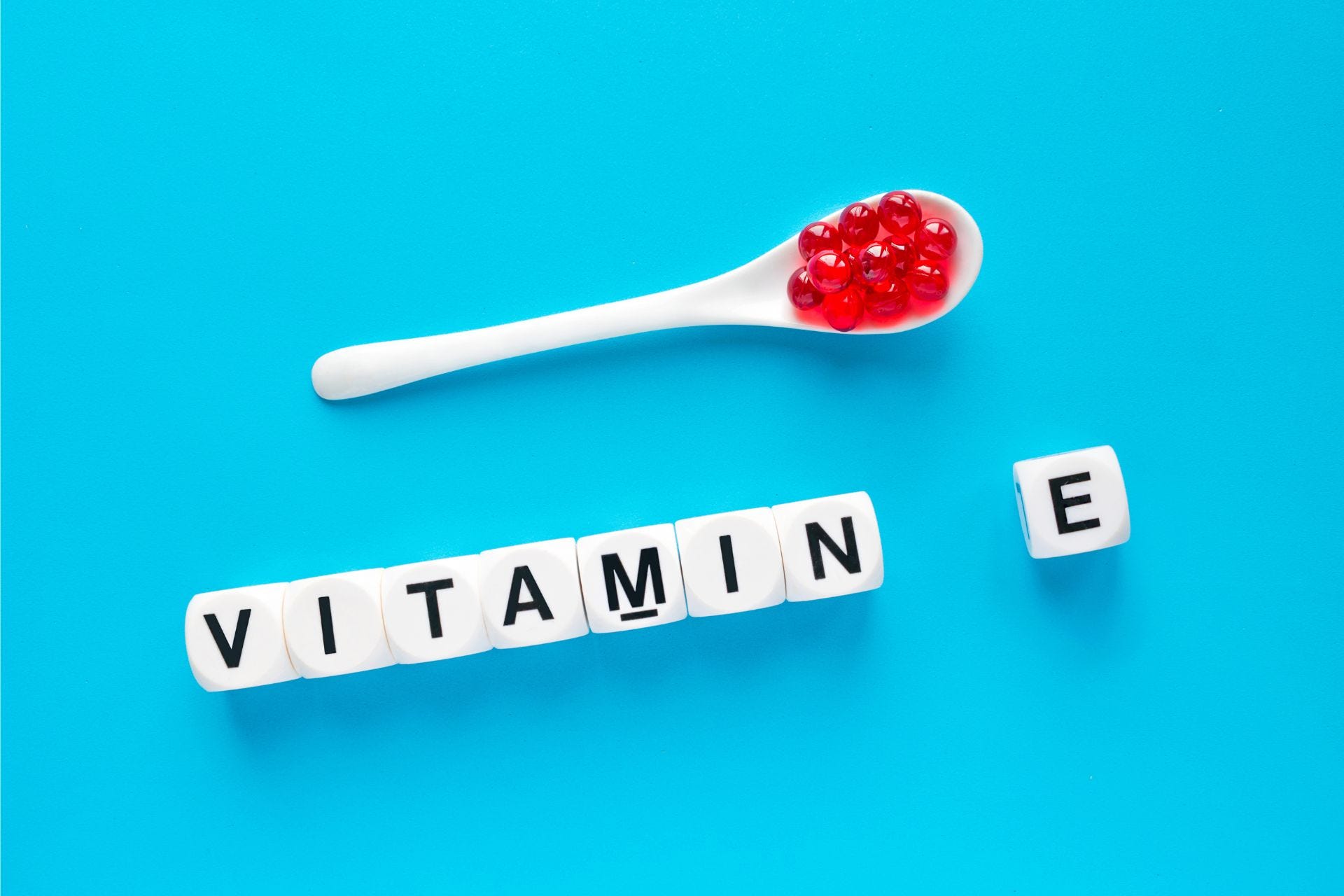 Spoon and blocks spelling vitamin e