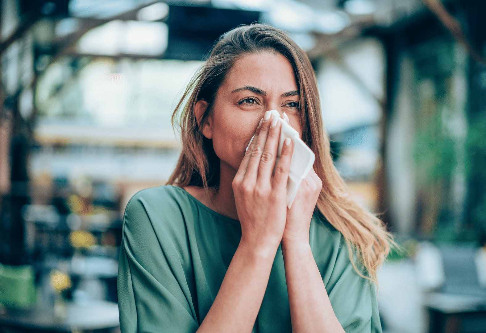 Woman Blowing Nose