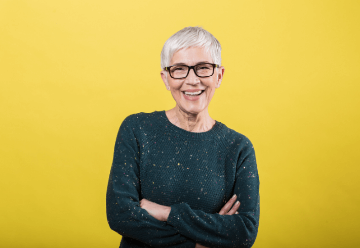Happy Healthy Woman on Yellow Background