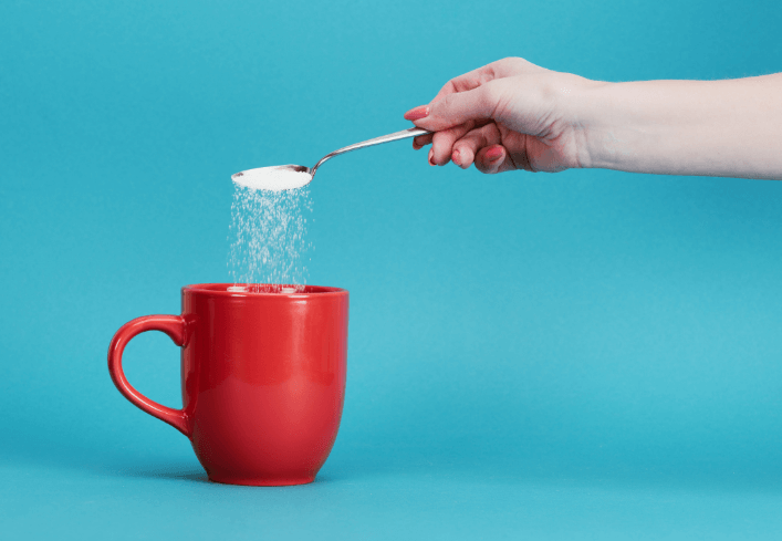 Sugar Poured Into Tea Coffee 