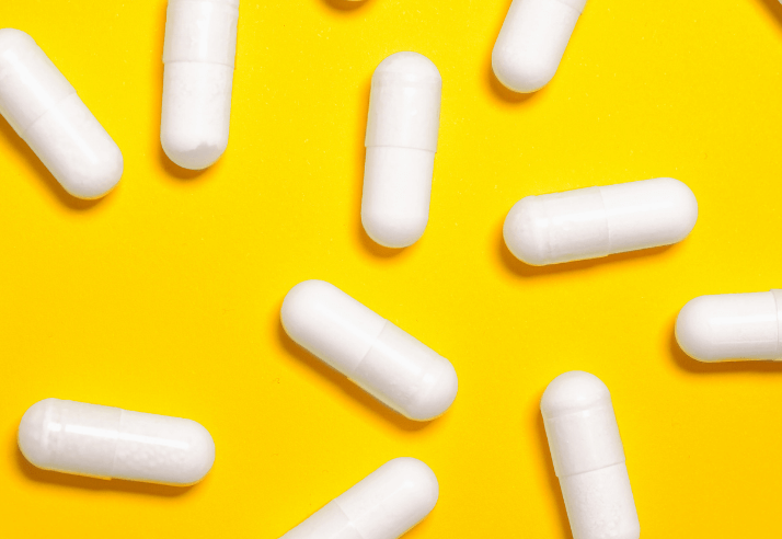 Capsules on Yellow Background
